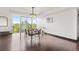 Well-lit dining area featuring hardwood flooring, bar cart and a large window with natural views at 1900 E Girard Pl # 505, Englewood, CO 80113