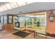 Building lobby has glass doors, an indoor bench, and a brick exterior at 1900 E Girard Pl # 505, Englewood, CO 80113