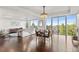 Bright, open-concept living and dining space featuring hardwood floors and panoramic views at 1900 E Girard Pl # 505, Englewood, CO 80113