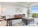 Bright living room with a large window, area rug, and modern furniture at 1900 E Girard Pl # 505, Englewood, CO 80113