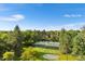 Aerial view of tennis courts, greenery, and landscaping at 1900 E Girard Pl # 505, Englewood, CO 80113