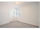 Cozy bedroom with plush carpeting, a window, and white walls for a bright and inviting atmosphere at 2484 W 69Th Pl, Denver, CO 80221