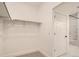 Walk-in closet with ample storage and easy access to the ensuite bathroom with standup shower at 2484 W 69Th Pl, Denver, CO 80221