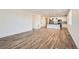 Spacious living area flowing into a modern kitchen, perfect for entertaining guests and comfortable living at 2484 W 69Th Pl, Denver, CO 80221