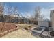 Large backyard with a patio area, raised garden beds, storage shed, and plenty of space for outdoor activities at 4063 S Quintero Way, Aurora, CO 80013