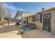 Relaxing backyard patio area with comfortable seating, grill, and pergola for outdoor enjoyment at 4063 S Quintero Way, Aurora, CO 80013