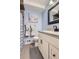 Beautifully updated bathroom with modern vanity, new fixtures, and decorative accents at 4063 S Quintero Way, Aurora, CO 80013