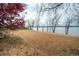 Sandy beach with blossoming trees and calm water, a serene setting for peaceful recreation at 4063 S Quintero Way, Aurora, CO 80013