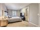 Cozy bedroom featuring neutral walls, carpet, and window, plus television for relaxing evenings at 4063 S Quintero Way, Aurora, CO 80013