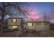 Charming two-story home with a well-manicured front yard, garage, and inviting entryway at 4063 S Quintero Way, Aurora, CO 80013