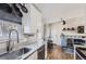 Well-appointed kitchen featuring stainless steel appliances, a sink, and a view to the breakfast nook at 4063 S Quintero Way, Aurora, CO 80013