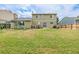 A green back yard with play equipment and lawn at 16051 E Alabama Dr, Aurora, CO 80017