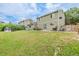 A green back yard with play equipment and lawn at 16051 E Alabama Dr, Aurora, CO 80017