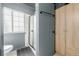 Updated bathroom featuring a shower with black trim and a modern cabinet at 16051 E Alabama Dr, Aurora, CO 80017