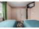 Bedroom with pink walls, closet, and a colorful butterfly rug at 16051 E Alabama Dr, Aurora, CO 80017