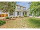Charming two-story home featuring a well-maintained lawn and attractive landscaping at 16051 E Alabama Dr, Aurora, CO 80017