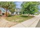 Attractive two-story home with a green lawn and charming curb appeal at 16051 E Alabama Dr, Aurora, CO 80017