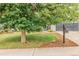 Charming home with a well-maintained lawn, mature tree, and a vintage mailbox at 16051 E Alabama Dr, Aurora, CO 80017