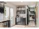 Kitchen featuring granite countertops, wine storage, and access to the backyard at 16051 E Alabama Dr, Aurora, CO 80017