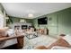Inviting living room featuring a cozy fireplace, plush seating, and stylish decor at 16051 E Alabama Dr, Aurora, CO 80017