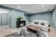 Finished basement featuring a sofa, fireplace and accent seating at 16051 E Alabama Dr, Aurora, CO 80017