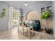Charming living room with wainscotting detail, large window, and natural light at 16051 E Alabama Dr, Aurora, CO 80017