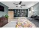 Spacious main bedroom featuring an expansive built-in shelving unit, neutral carpet, and natural light at 16051 E Alabama Dr, Aurora, CO 80017