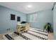 Comfortable office area with a desk, chair, and a patterned rug at 16051 E Alabama Dr, Aurora, CO 80017