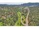 Beautiful aerial shot of the neighborhood, showcasing lush greenery and mountain views at 30273 Conifer Rd, Evergreen, CO 80439