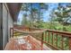 Outdoor deck featuring a relaxing hammock and views of the surrounding trees and nature at 30273 Conifer Rd, Evergreen, CO 80439