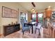 Dining room area with natural light, a dining table, and an outside deck at 30273 Conifer Rd, Evergreen, CO 80439
