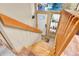 Entryway view down stairway, showing small shelf with plants at 30273 Conifer Rd, Evergreen, CO 80439
