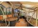 Interior of a greenhouse with large pots and plant supports and a fan for air ciculation at 30273 Conifer Rd, Evergreen, CO 80439