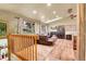 Open living space with a fireplace, windows and comfortable leather seating at 30273 Conifer Rd, Evergreen, CO 80439