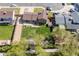 Aerial view of house with fenced backyard, patio, and mature trees at 2399 E 99Th Way, Thornton, CO 80229
