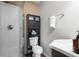 This bathroom features a glass shower, a toilet with storage, and a sink at 2399 E 99Th Way, Thornton, CO 80229