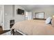 Comfortable bedroom with bedside tables, lamps and a large bed at 2399 E 99Th Way, Thornton, CO 80229