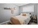 Relaxing bedroom decorated with wall art, neutral decor, and filled with natural light at 2399 E 99Th Way, Thornton, CO 80229