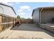 Side driveway leading to backyard, with wood fence on the side, and space for parking vehicles at 2399 E 99Th Way, Thornton, CO 80229