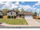 Charming ranch-style home with a well-manicured lawn and attached two-car garage at 2399 E 99Th Way, Thornton, CO 80229