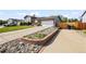 Two-story home with brick accents, a well-manicured lawn, and an attached two-car garage at 2399 E 99Th Way, Thornton, CO 80229