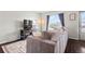 Comfortable living room with a large window that lets in natural light at 2399 E 99Th Way, Thornton, CO 80229
