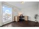 Bright office space features beautiful wood floors, a large window, and a built in desk at 2399 E 99Th Way, Thornton, CO 80229