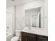 A bathroom featuring a vanity with dark wood cabinets and a white countertop at 6531 N Malaya St, Aurora, CO 80019