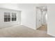 Sun-filled bedroom featuring large window and plush carpeting at 6531 N Malaya St, Aurora, CO 80019