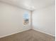 The bedroom features neutral carpet, white walls and window at 6531 N Malaya St, Aurora, CO 80019