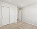 A bright bedroom features carpet, closet and white walls at 6531 N Malaya St, Aurora, CO 80019