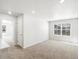 Bright, carpeted bedroom with a large window and neutral wall color at 6531 N Malaya St, Aurora, CO 80019