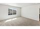 Bright bedroom with a window showcasing the neighborhood at 6531 N Malaya St, Aurora, CO 80019