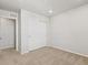A bedroom features a closet with white, sliding doors and neutral carpet at 6531 N Malaya St, Aurora, CO 80019
